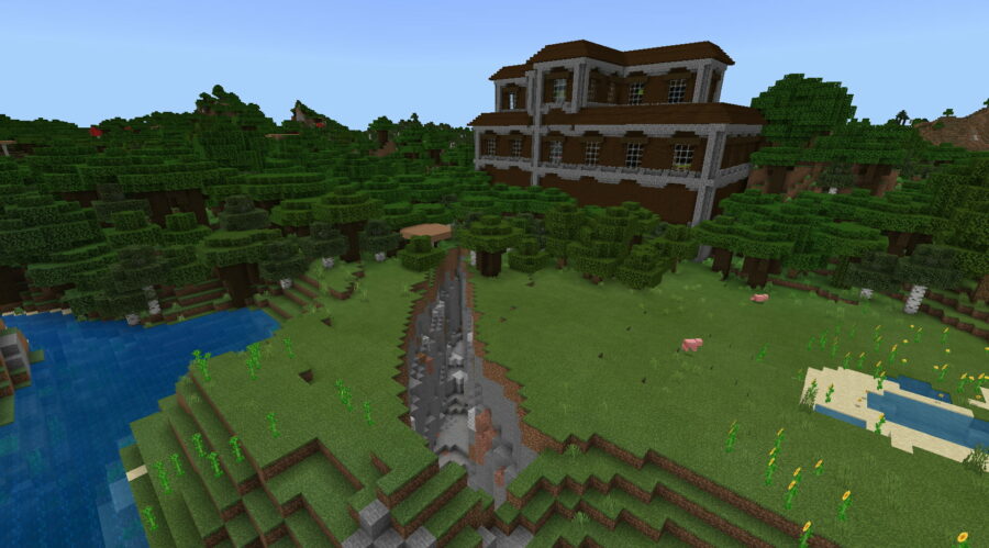 Una mansión con forma de castillo en Minecraft.
